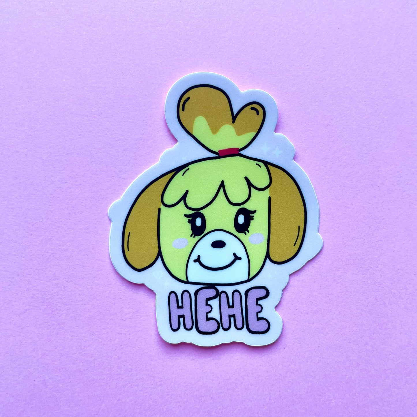 Cartoon dog sticker with 'HEHE' text on a purple background